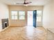 Bright living room with hardwood floors, a fireplace, and an open floor plan at 123 Oak St, Chester, SC 29706