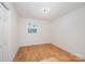 Bright bedroom with wood-look floors and ample natural light at 129 Doster Rd, Lancaster, SC 29720