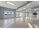 Spacious basement recreation room with lake views and mirrors at 16100 Woolwine Rd, Charlotte, NC 28278