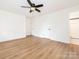 Bright bedroom with wood-look flooring, and two closets at 2742 Creekbed Ln, Charlotte, NC 28210