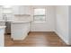 Kitchen with white cabinets, quartz countertops, and breakfast bar at 2742 Creekbed Ln, Charlotte, NC 28210