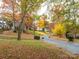 Residential street lined with autumn trees at 2742 Creekbed Ln, Charlotte, NC 28210