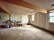 Unfinished basement with concrete flooring, workbench, and windows at 4301 Beatty Dr, Charlotte, NC 28214