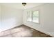 Bright bedroom with carpet flooring and a double window offering natural light at 4301 Beatty Dr, Charlotte, NC 28214