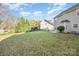 Spacious backyard with grassy area and wooden fence at 6500 Forestrock Dr, Charlotte, NC 28269