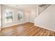 Bright living room with hardwood floors, a fireplace, and a staircase at 6500 Forestrock Dr, Charlotte, NC 28269