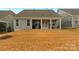 Large backyard with covered patio, offering ample space at 7014 Jolly Brook Dr, Charlotte, NC 28215