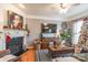 Living room with hardwood floors, fireplace, and a large TV at 819 Granby Dr, Fort Mill, SC 29708