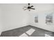 Bright, spacious bedroom with gray carpet and large windows at 8827 Treyburn Dr, Charlotte, NC 28216