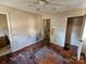 Bedroom with hardwood floors and damaged walls and trim at 934 Pebble Rd, Rock Hill, SC 29730