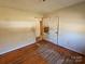 Small bedroom with hardwood floors needing refinishing and some repairs at 934 Pebble Rd, Rock Hill, SC 29730