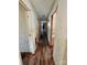 Long hallway with dirty hardwood floors needing refinishing at 934 Pebble Rd, Rock Hill, SC 29730