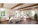 Spacious bedroom with wood floors, large windows, and ceiling beams at 0 S Potter Rd # 1A, Waxhaw, NC 28173