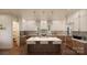 Modern kitchen with large island, white and wood cabinets at 0 S Potter Rd # 1A, Waxhaw, NC 28173
