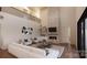 Spacious living room with a stone fireplace and high ceilings at 0 S Potter Rd # 1A, Waxhaw, NC 28173