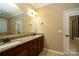 Bathroom with double vanity and granite top at 10528 Royal Winchester Dr, Charlotte, NC 28277