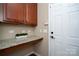 Well-equipped laundry room with built-in cabinets at 10528 Royal Winchester Dr, Charlotte, NC 28277