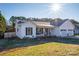 Front view of a charming white house with a two-car garage at 112 Henry Putnam Dr, Cherryville, NC 28021