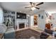 Spacious living room features a fireplace, hardwood floors, and a large TV at 112 Henry Putnam Dr, Cherryville, NC 28021