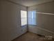 Well-lit bedroom with corner window and carpet at 1640 English Knoll Dr # 43, Matthews, NC 28105