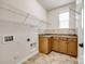 Laundry room with built-in shelving and tile floor at 373 Fischer Rd, Fort Mill, SC 29715