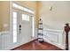 Bright foyer with white door, sidelight, and hardwood floors at 4669 Carrington Dr, Lancaster, SC 29720