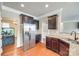 Modern kitchen featuring stainless steel appliances, granite countertops, and wood cabinetry at 4669 Carrington Dr, Lancaster, SC 29720