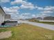 Spacious backyard with hot tub, grassy area, and privacy fence at 5021 Markfield Ln, Monroe, NC 28110