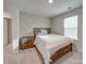 Bedroom with wood bed frame and accent wall at 5021 Markfield Ln, Monroe, NC 28110