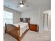 Bright bedroom featuring a double bed, nightstand, and window with blinds at 5021 Markfield Ln, Monroe, NC 28110