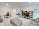 Versatile bonus room with a work area, entertainment center, and ample natural light at 5021 Markfield Ln, Monroe, NC 28110