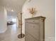 Bright and airy entryway with coat rack and shoe storage at 5021 Markfield Ln, Monroe, NC 28110