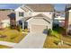 Two-story house with attached garage, landscaping, and a concrete driveway at 5021 Markfield Ln, Monroe, NC 28110