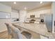 Modern kitchen with white cabinets, granite countertops, and stainless steel appliances at 5021 Markfield Ln, Monroe, NC 28110