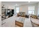 Relaxing living area with sofas, coffee table, and an entertainment center at 5021 Markfield Ln, Monroe, NC 28110