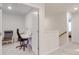 Upstairs loft area with a desk and chair, perfect for a home office or study at 5021 Markfield Ln, Monroe, NC 28110