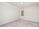 Cozy carpeted bedroom with a window and neutral color palette at 562 Shepherd Ln, Clover, SC 29710