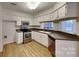 Well-equipped kitchen with stainless steel appliances and light cabinets at 6020 Gray Gate Ln # I, Charlotte, NC 28210