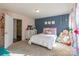 Bedroom with pink accent wall, polka dot bedding, and plenty of natural light at 6076 Artigas Dr, Fort Mill, SC 29707