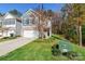 Two-story home with gray siding, stone accents, and a two-car garage at 6076 Artigas Dr, Fort Mill, SC 29707