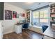 Bright home office with built-in shelving, window seat, and two desks at 6076 Artigas Dr, Fort Mill, SC 29707