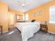 Bright bedroom with double bed, carpet, and ceiling fan at 7909 Lawyers Rd, Charlotte, NC 28227