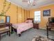 Bedroom with twin bed, desk, and decorative wall accents at 7909 Lawyers Rd, Charlotte, NC 28227