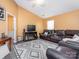 Living room with leather furniture and fireplace at 7909 Lawyers Rd, Charlotte, NC 28227