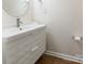 Simple bathroom with white vanity, geometric pattern, and modern fixtures at 8127 Paw Club Dr, Charlotte, NC 28214