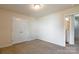 Spacious bedroom with double closet doors and access to a bathroom at 8127 Paw Club Dr, Charlotte, NC 28214