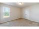 Charming bedroom with a window, closet, and neutral wall colors at 8127 Paw Club Dr, Charlotte, NC 28214