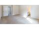 Spacious bedroom with neutral decor, carpet flooring, and access to bathroom at 8127 Paw Club Dr, Charlotte, NC 28214