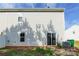 Rear view of house showing sliding glass doors and AC unit at 8127 Paw Club Dr, Charlotte, NC 28214