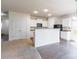 Modern kitchen with white cabinetry, granite countertops, and black appliances at 8127 Paw Club Dr, Charlotte, NC 28214